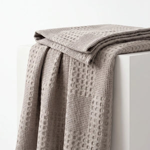 Waffle Weave Cotton Blanket folded to show its thickness and drape