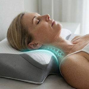 Cervical pillow shown beside a standard pillow for size comparison