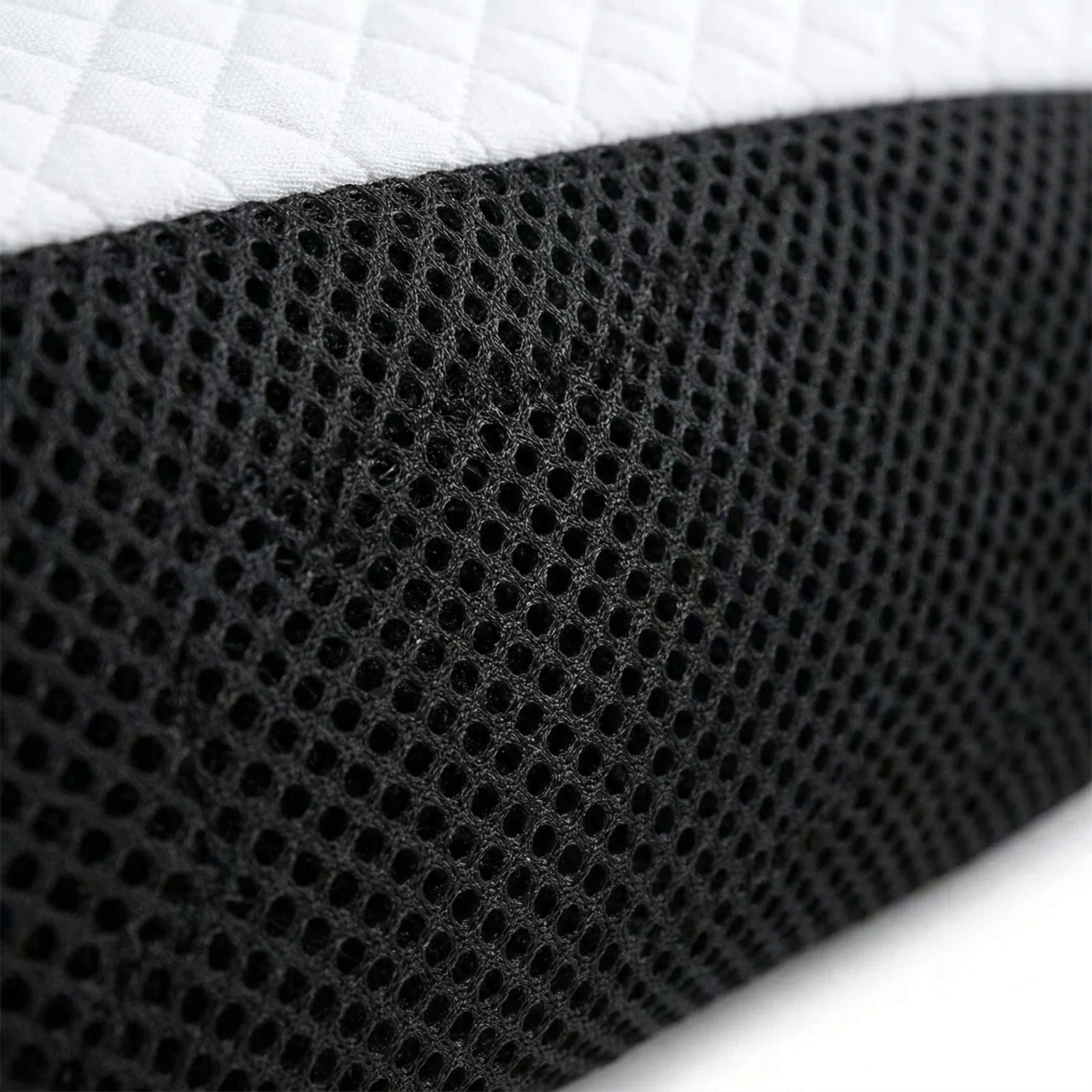 Cervical pillow centred on a white duvet