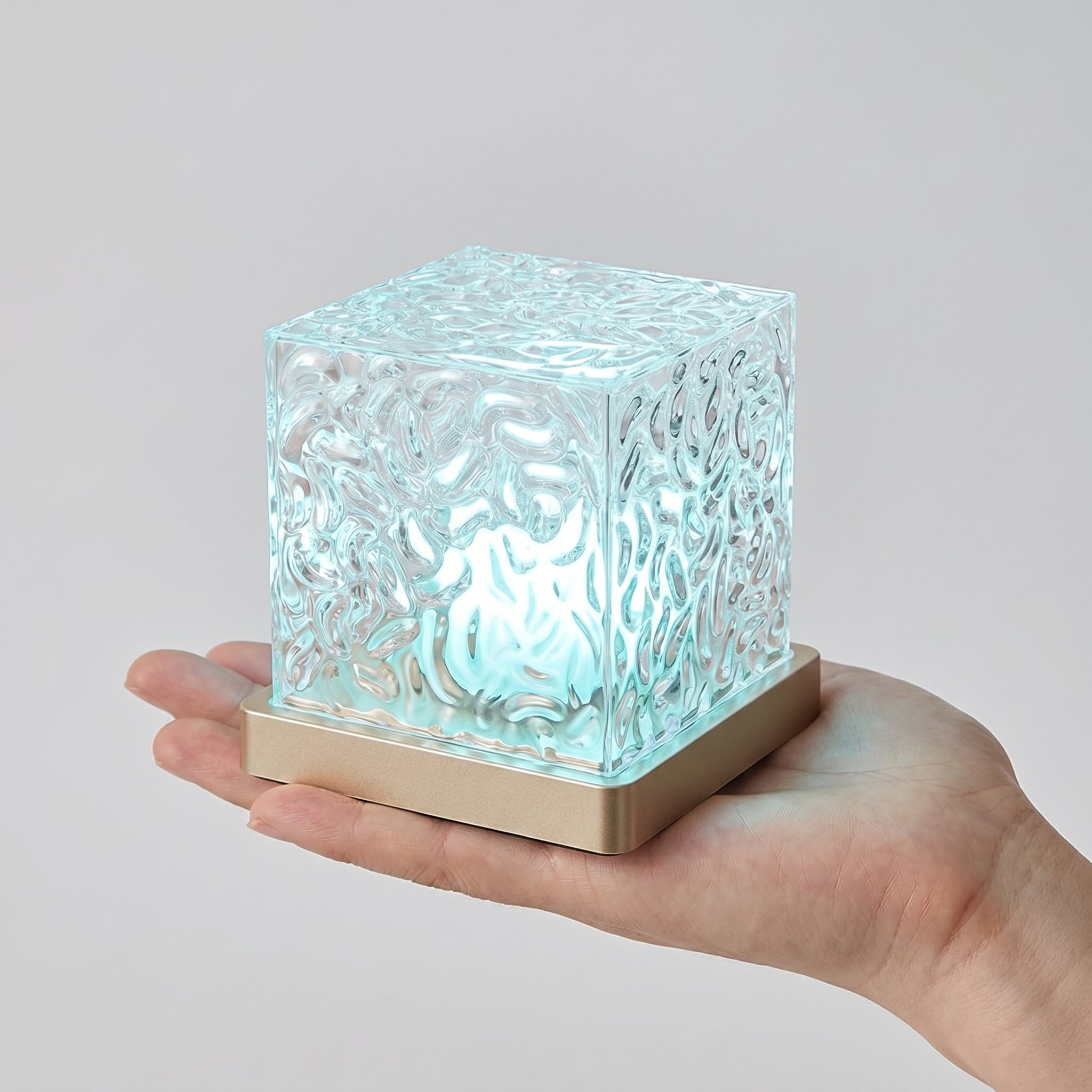 Compact palm-sized aurora wave lamp held in hand