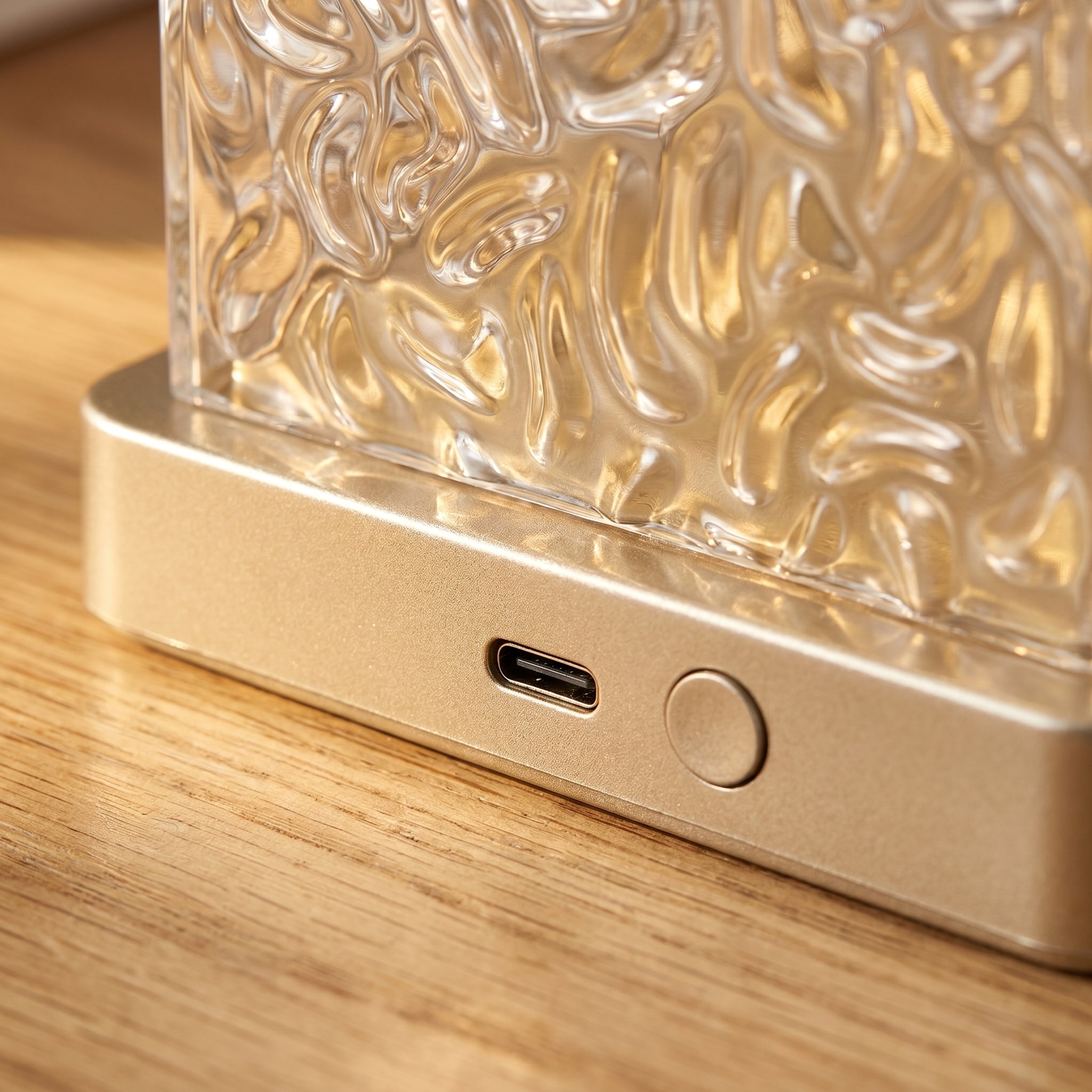 USB-C port and touch button detail on gold base