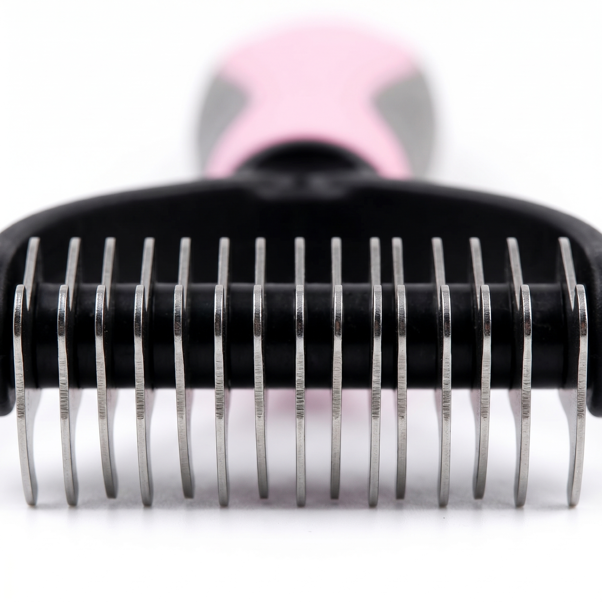 Close-up macro of stainless steel dematting rake teeth — precision metalwork for mat removal