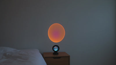 Cinematic pan across Scandinavian bedroom with sunset projection light filling the wall