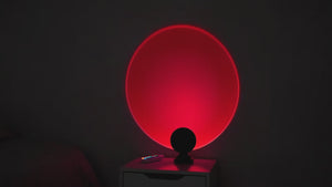 Sunset Projection Light cycling through 16 color modes in dark bedroom