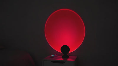 Sunset Projection Light cycling through 16 color modes in dark bedroom