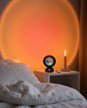 Sunset Projection Light on nightstand in dark Scandinavian bedroom