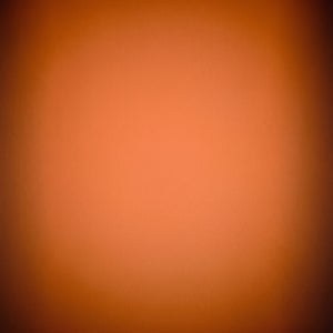 Warm sunset gradient projected on white Scandinavian wall