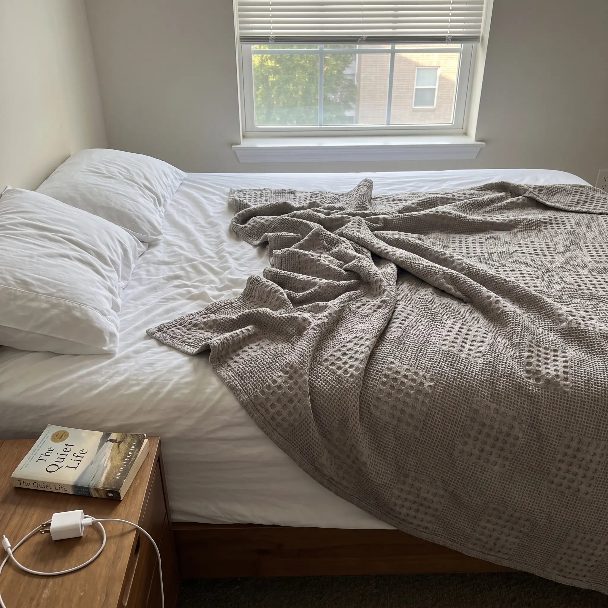 Waffle Weave Cotton Blanket on a bed in morning light
