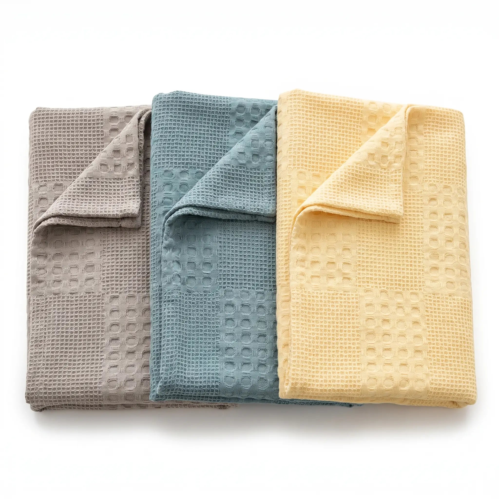 Waffle Weave Cotton Blanket in Stone, Nordic Blue and Butter side by side