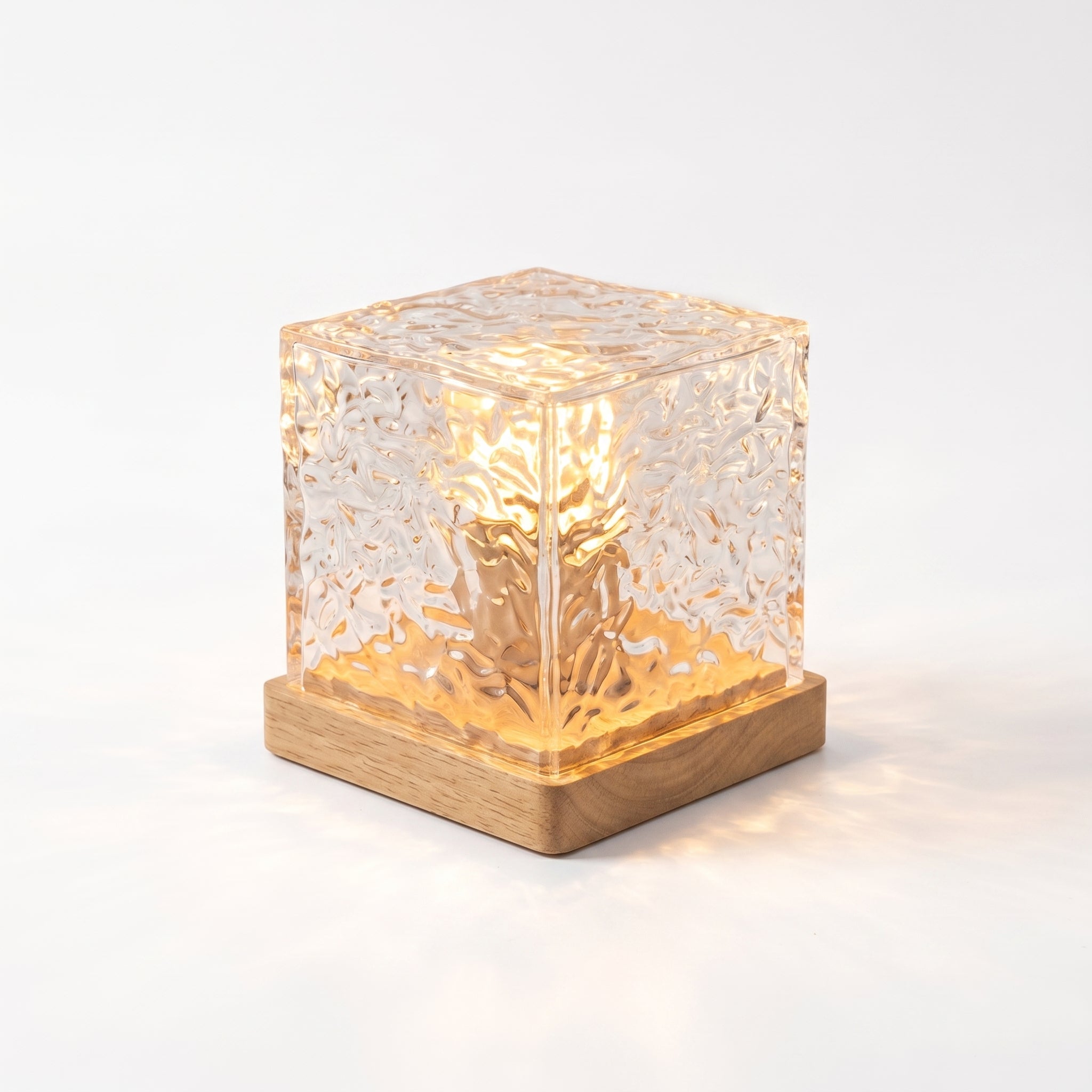 Water Ripple Projection Lamp – clear acrylic cube on wood base, studio shot